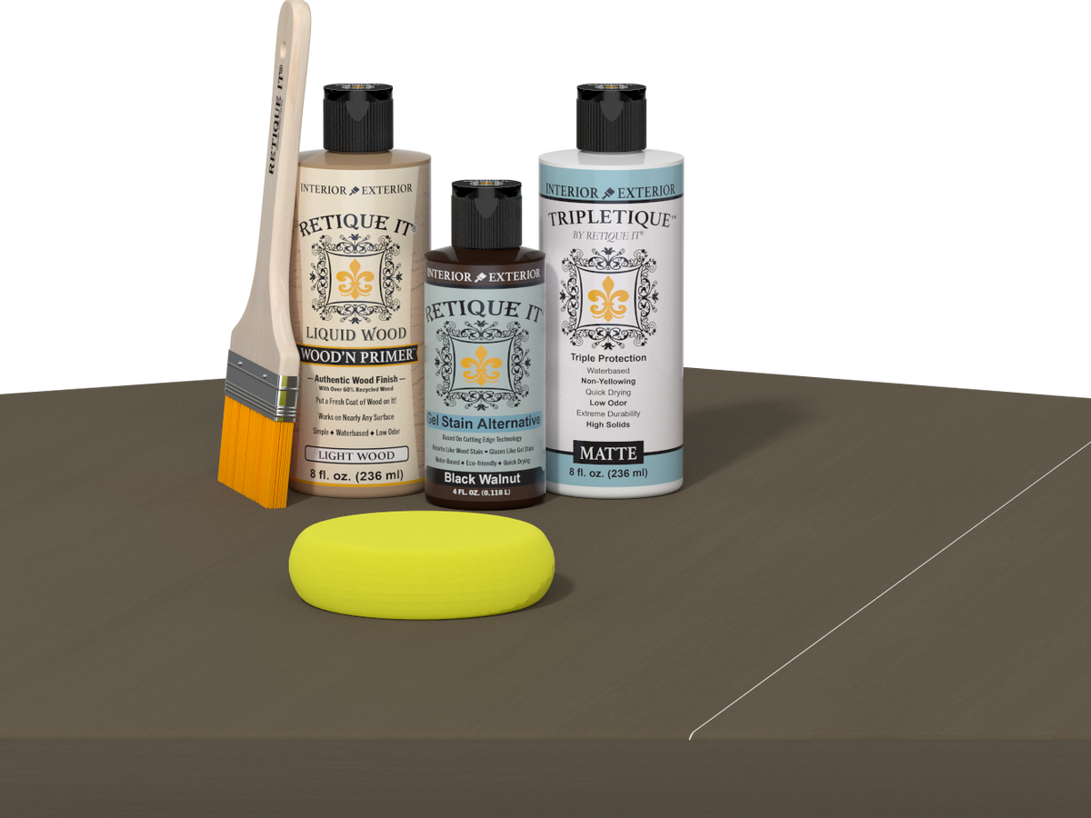 Retique It Black Walnut Kit with Matte Tripletique, Light Wood Wood'n Primer, Black Walnut Gel Stain Alternative, paintbrush, and yellow sponge on a tabletop.