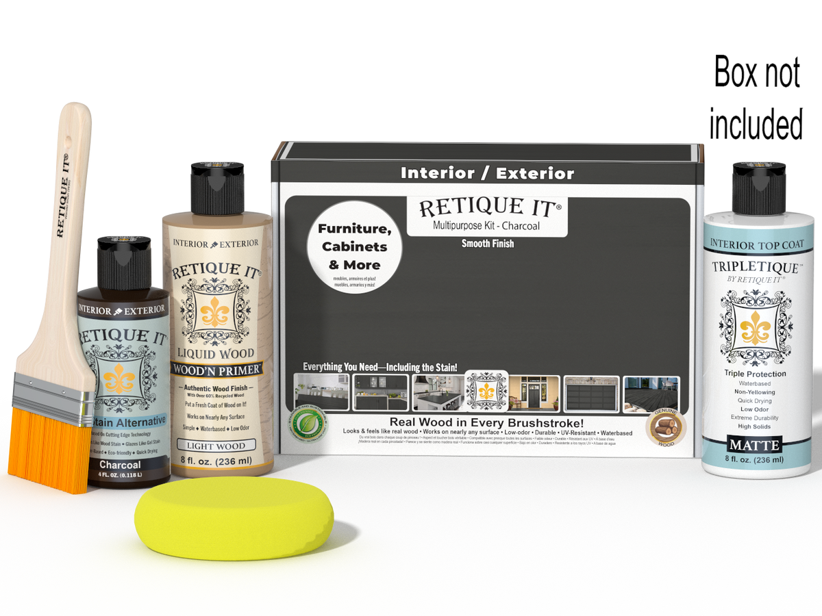 Retique It® Multipurpose Kit - Charcoal with primer, charcoal gel stain alternative, matte topcoat, brush, sponge, and red graining tools beside the box.