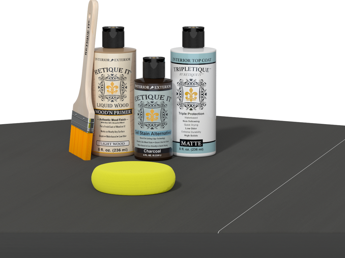 Retique It® Light Wood Wood’n Primer with Charcoal Gel Stain Alternative, matte topcoat, brush, and yellow sponge on a dark tabletop.