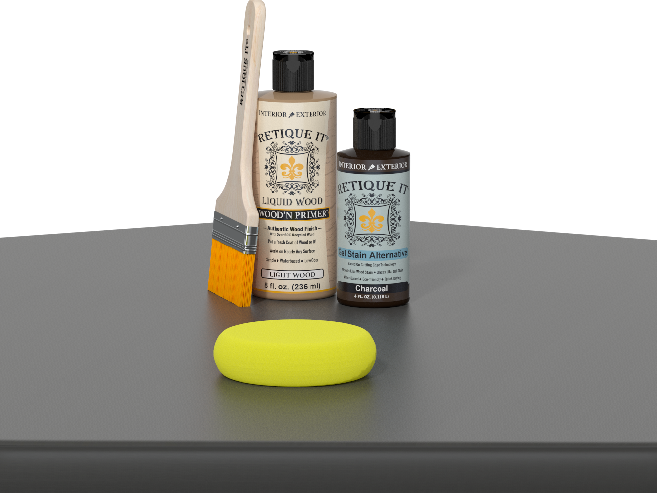 Retique It® Charcoal Kit with Light Wood’n Primer, Charcoal Gel Stain Alternative, paintbrush, and yellow sponge on a charcoal gray tabletop.