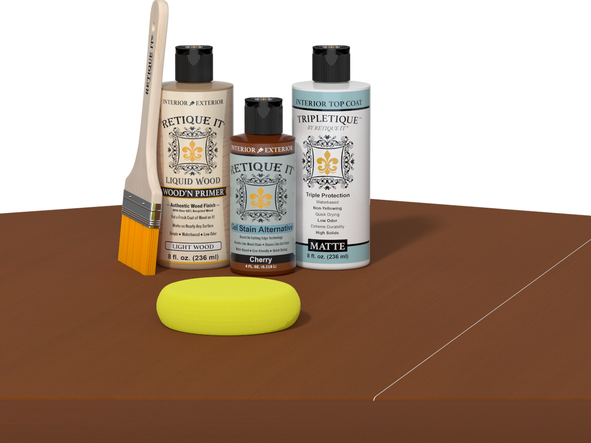 Retique It® Light Wood Wood’n Primer with Cherry Gel Stain Alternative, matte topcoat, brush, and yellow sponge on a brown tabletop.