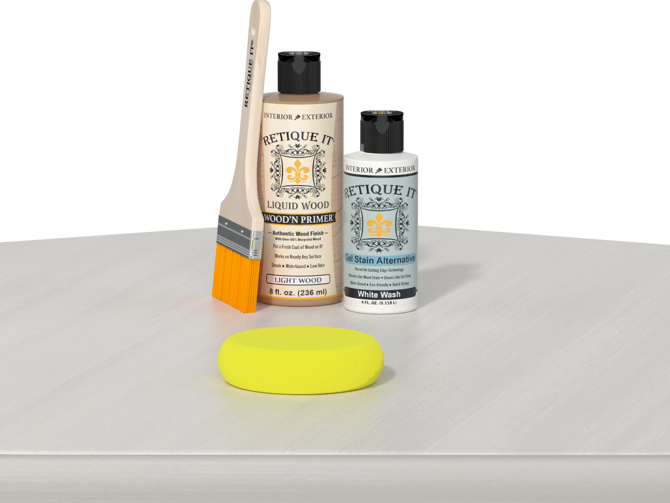 Retique It® Light Wood Wood’n Primer with White Wash Gel Stain Alternative, brush, and yellow sponge on a white tabletop.