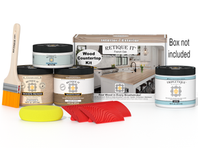 Wood countertop kit with paint cans, a brush, and packaging on a white background