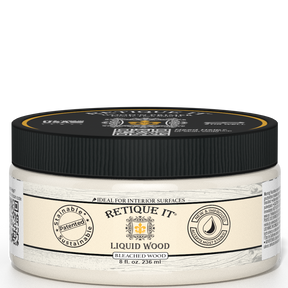 Retique It® Liquid Wood 8oz Bleached interior paint in a jar, showcasing the wood-like finish and product packaging.