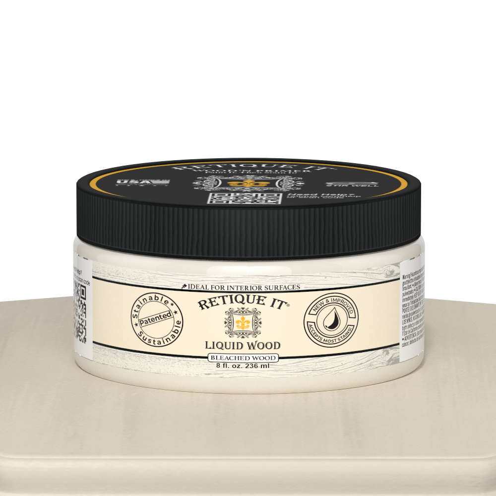 Retique It® Liquid Wood 8oz bleached interior paint jar on table, showcasing smooth, light-colored wood finish for home decor projects.