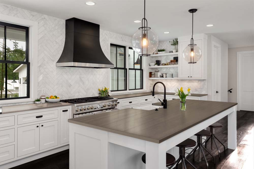 Retique It Multi-purpose Smooth Finish Kit (Large) in Harbor Gray on a kitchen countertop, showing a sleek wood finish application.