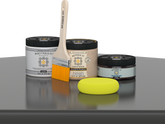 Retique It® Charcoal Brush-On Kit with Gloss PolyTique® includes a brush, Light Wood primer, Charcoal Gel Stain Alternative, Gloss PolyTique® top coat, and a yellow sponge.