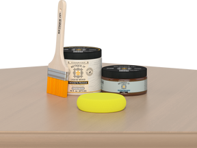 Retique It® White Oak Multipurpose Kit contents with Liquid Wood primer, Pecan gel stain alternative, paintbrush, and yellow sponge displayed on a light wood surface.