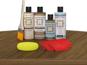Retique It® Wood'n Finish Kit in Barn Wood stain shown on tabletop, highlighting the wood finish application and natural grain detail.