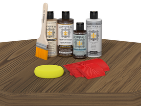 Wood care products including bottles, a brush, a sponge, and cloths on a wooden surface.