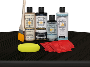 Retique It® Wood'n Finish Kit in Classic Black for tabletop staining, includes stain and finishing supplies on a wooden surface.