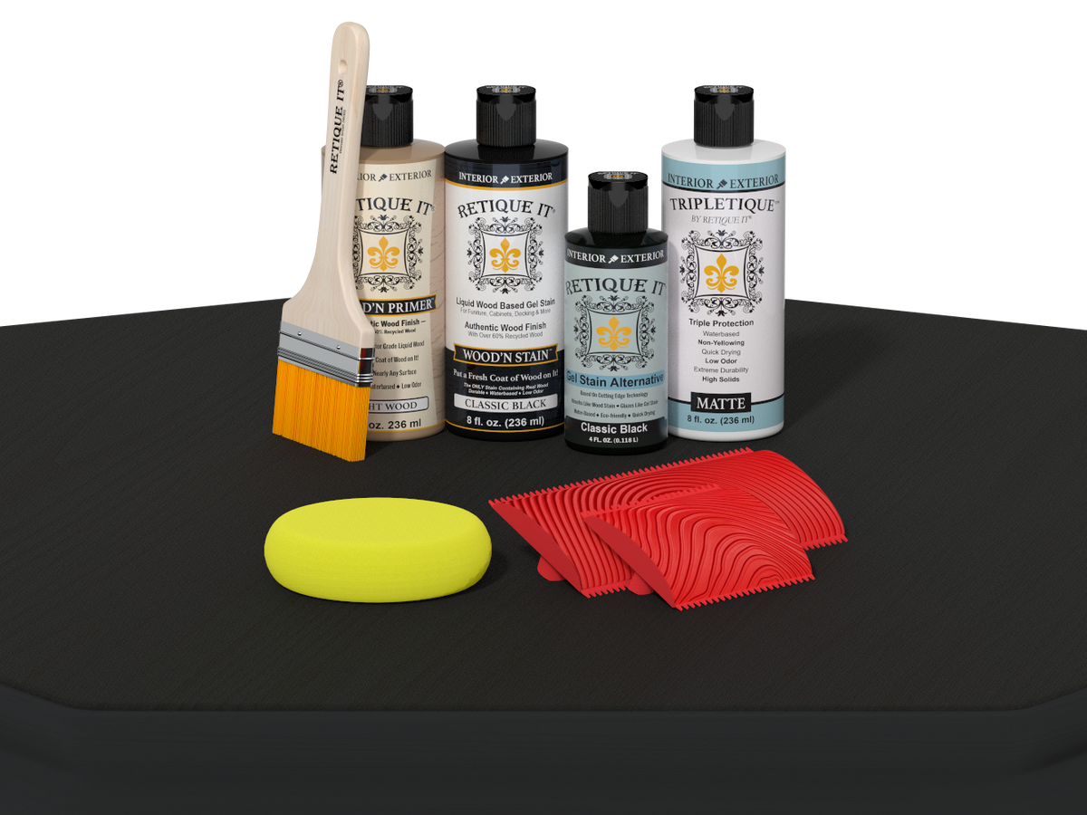Set of car care products including bottles, a brush, and cloths on a black surface.