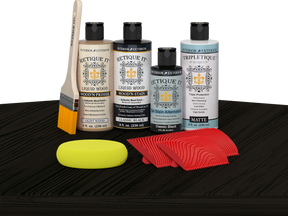 Retique It® Wood'n Finish Kit in Classic Black stain shown on table surface for woodworking and furniture finishing.