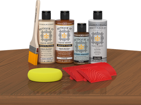 Retique It® Wood'n Kit Cedar exterior top coat on a table, featuring a multi-purpose wood finish set with brush and product containers.