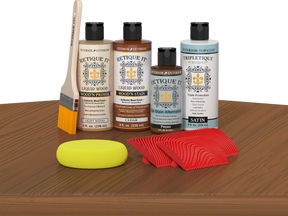 Retique It® Cedar Wood'n Kit with Light Wood primer, Cedar stain, Pecan gel stain alternative, Satin Tripletique® Top Coat, brush, red graining tool, and yellow sponge.