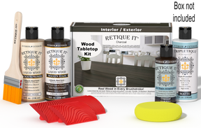 Retique It® Wood'n Finish Kit in Charcoal for tabletops, showing stain bottles and application tools on a wooden surface.