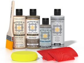 Retique It® Wood'n Kit with driftwood finish, including exterior top coat, featuring wood finish supplies and tools on a flat surface.