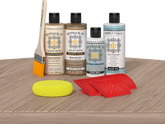 Retique It® French Oak Wood'n Kit with Light Wood primer, Barn Wood stain, White Wash gel stain alternative, Matte Tripletique® Top Coat, brush, red graining tool, and yellow sponge.