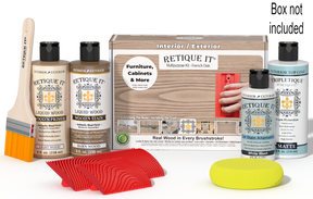 Retique It® French Oak Multipurpose Kit with Light Wood primer, Barn Wood stain, White Wash gel stain alternative, Matte Tripletique® Top Coat, brush, red graining tool, yellow sponge, and product box.