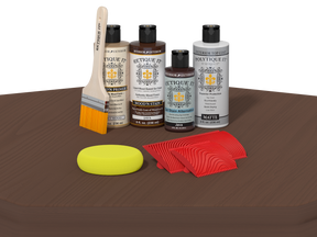 Set of wood care products including bottles, a brush, a sponge, and cloths on a brown surface.