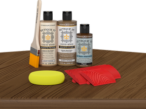 Retique It® Modern Walnut Wood Kit with primer, stains, brush, yellow sponge, and red graining tools.