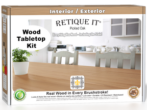 Retique It® Wood'n Finish Kit in Pickled Oak stain showing a wooden tabletop with the stain applied and the kit box.