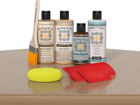 Retique It® Wood'n Finish Kit in Pickled Oak for interior wood projects, shown on a table with application tools.