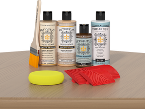 Retique It® Wood'n Finish Kit in Pickled Oak for interior wood projects, shown on a table with application tools.