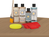 Retique It® Pickled Oak Wood'n Kit with Light Wood primer, Pickled Oak stain, Pecan gel stain alternative, Matte Tripletique® Top Coat, brush, red graining tool, and yellow sponge.