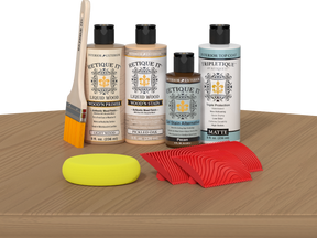 Retique It® Pickled Oak Wood'n Kit with Light Wood primer, Pickled Oak stain, Pecan gel stain alternative, Matte Tripletique® Top Coat, brush, red graining tool, and yellow sponge.