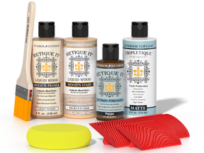 Retique It® Pickled Oak Wood'n Kit with Light Wood primer, Pickled Oak stain, Pecan gel stain alternative, Matte Tripletique® Top Coat, brush, red graining tool, and yellow sponge.