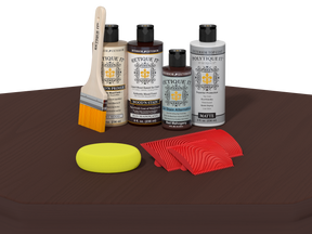 Collection of wood care products including bottles, a brush, a sponge, and cloths on a brown surface.