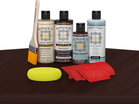 Retique It® Red Mahogany Wood'n Kit with Light Wood primer, Red Mahogany stain, Red Mahogany gel stain alternative, Satin Tripletique® Top Coat, brush, red graining tool, and yellow sponge.