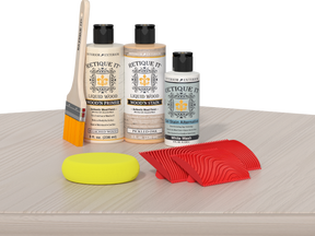 Retique It® Wood'n Finish Kit in Sun Bleached, showing wood mantel surface with light, sun-bleached wood finish and natural grain details.