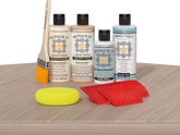 Retique It® Sun Bleached Wood'n Kit with Bleached Wood primer, Pickled Oak stain, White Wash gel stain alternative, Matte Tripletique® Top Coat, brush, red graining tool, and yellow sponge.