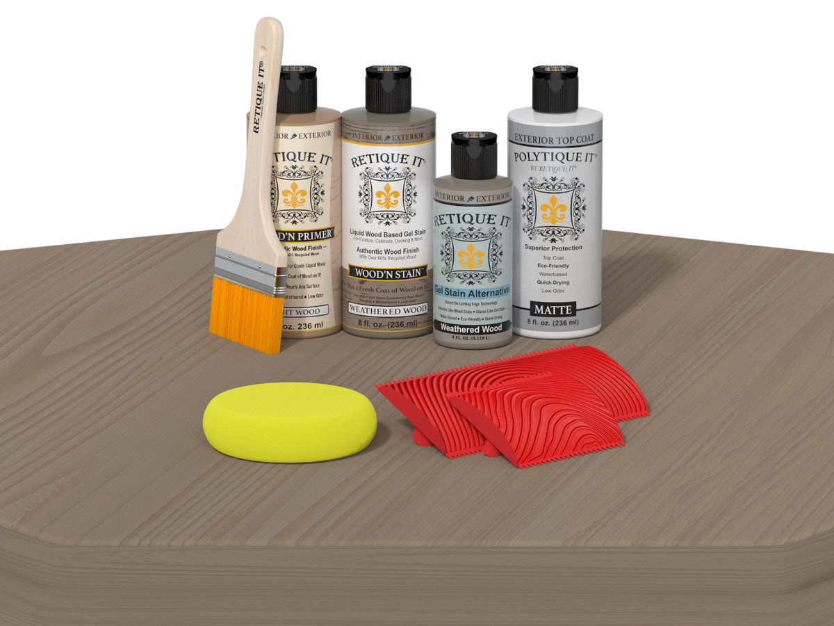 Collection of paint-related products including bottles, a brush, a sponge, and samples on a gray surface.