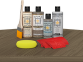 Retique It® Wood'n Finish Kit in Weathered Wood, exterior top coat, showing applicator and weathered wood finish on a wooden surface.