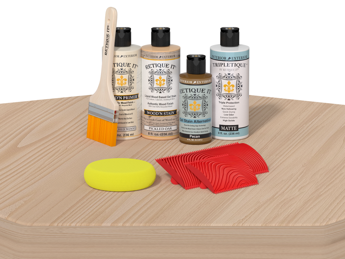 Set of wood care products including bottles, a brush, and sponges on a wooden surface.