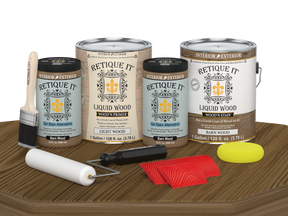 Retique It Wood'n Cabinet Kit with 48 barn wood-grained stained cabinet doors, shown on a table for easy installation.