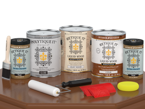 Retique It® Wood'n Finish Kit in cedar, exterior top coat, with four large containers, glossy finish, shown on a table.