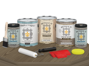 Retique It® Wood'n Finish Kit in Weathered Wood, interior top coat, showing four large matte wood finish containers on a table.