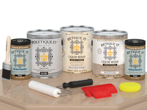 Retique It® Wood'n Finish Kit in WOAK PLTQ with glossy finish, shown on a table surface with wood grain details.