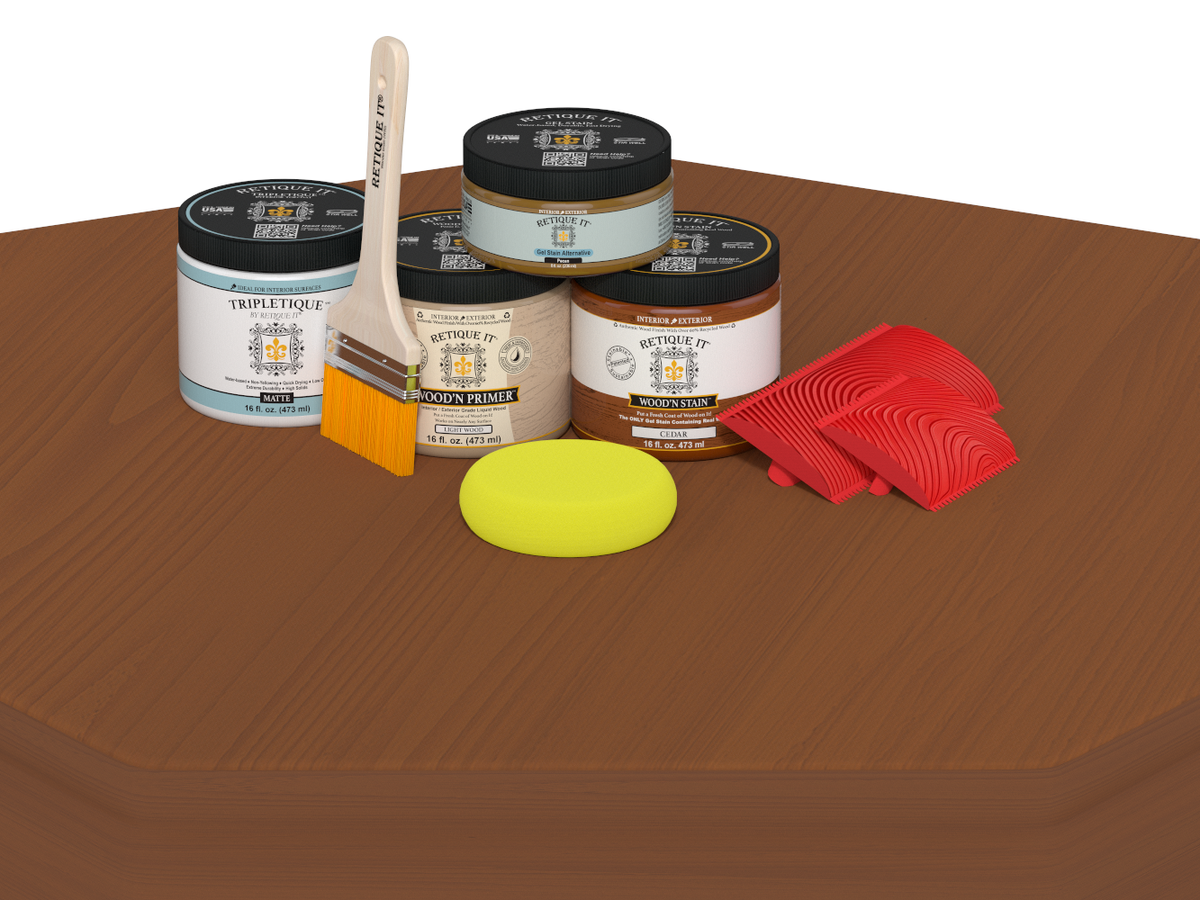 Paint cans, a brush, a sponge, and red tools on a brown surface