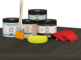 Retique It® charcoal countertop kit for kitchen island with stain finish, shown on a modern kitchen table.