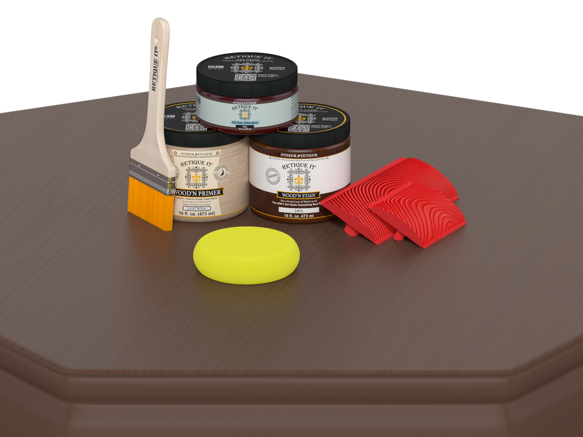 Painting supplies including jars, a brush, a sponge, and red tools on a brown surface.