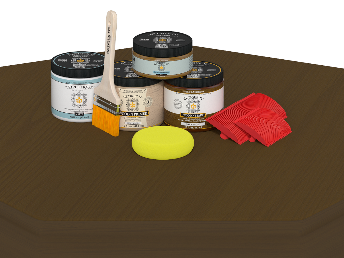 Collection of paint cans, a brush, a sponge, and red tools on a brown surface