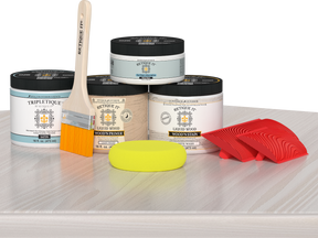 Retique It Wood'n Finish Kit in White Wash for interior top coat, displayed on table with wood sample and application tools