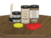 Retique It® Wood'n Cabinet Kit with 12 barn wood-grained stain doors displayed on a table. Natural wood textured finish.