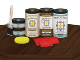 Retique It® Wood'n Finish Kit in Dark Oak stain with four large bottles, matte wood finish on a tabletop.