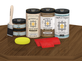 Retique It® Modern Walnut Wood Kit with primer, stain, gloss topcoat, brush, roller, yellow sponge, and red graining tools.